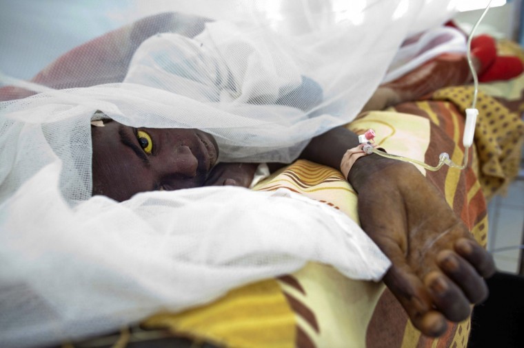 Saleh Mohammed Hamid, 18, from West Darfur's Gocker, is treated at Teaching Hospital after getting infected with yellow fever in El Geneina .According to UNAMID, the hospital, which has already treated 106 cases of yellow fever among of which 38 people have died, is expecting to receive thousands more vaccines. A yellow fever outbreak has killed nearly 100 people over the last seven weeks in Sudan's Darfur, the World Health Organization said, a region where fighting has undermined access to healthcare. The statement said 329 suspected yellow fever cases and 97 deaths had been reported since the last week of September. (Albert Gonzalez Farran/Reuters)